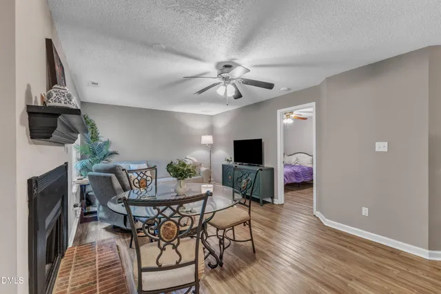 a view of a livingroom with furniture and a fireplace