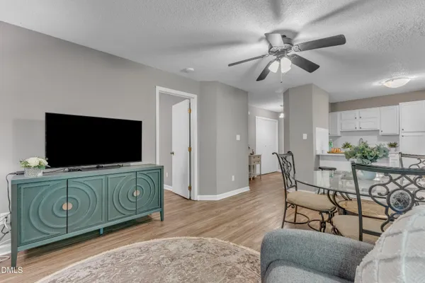 a view of a livingroom with furniture and flat screen tv