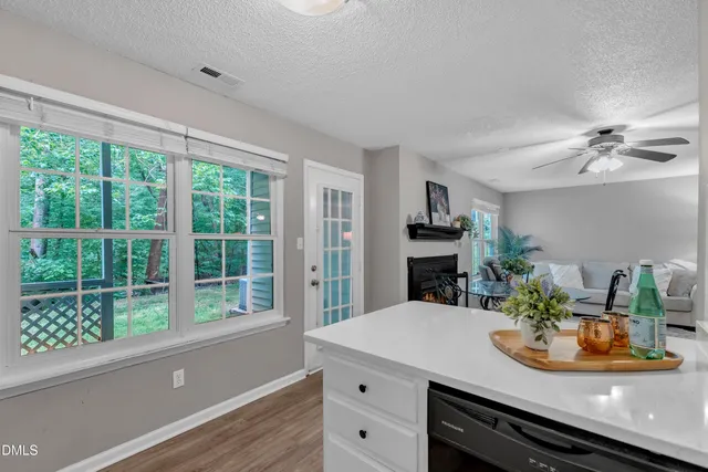 a kitchen with a table and chairs in it