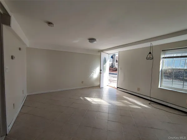 a view of an empty room and window
