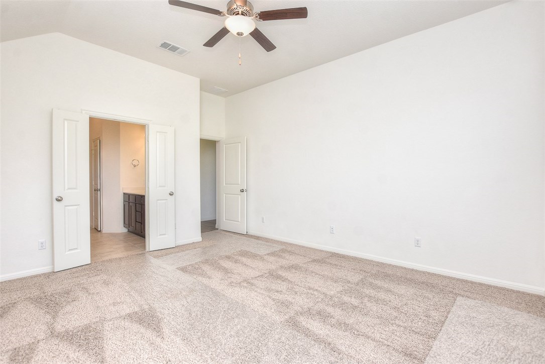 1449 Morning View Road Georgetown, TX 78628 - Photo 14 of 39 Master bedroom with vaulted ceiling