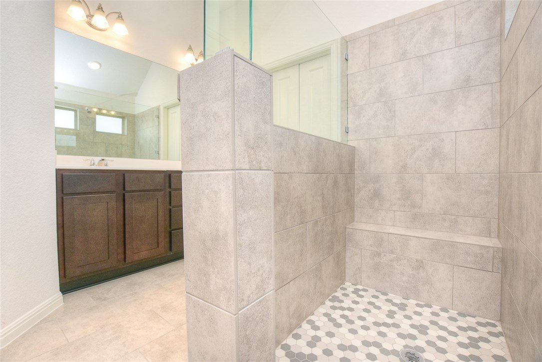 1449 Morning View Road Georgetown, TX 78628 - Photo 17 of 39 Large walk in shower in the master with a shower bench and tile floors