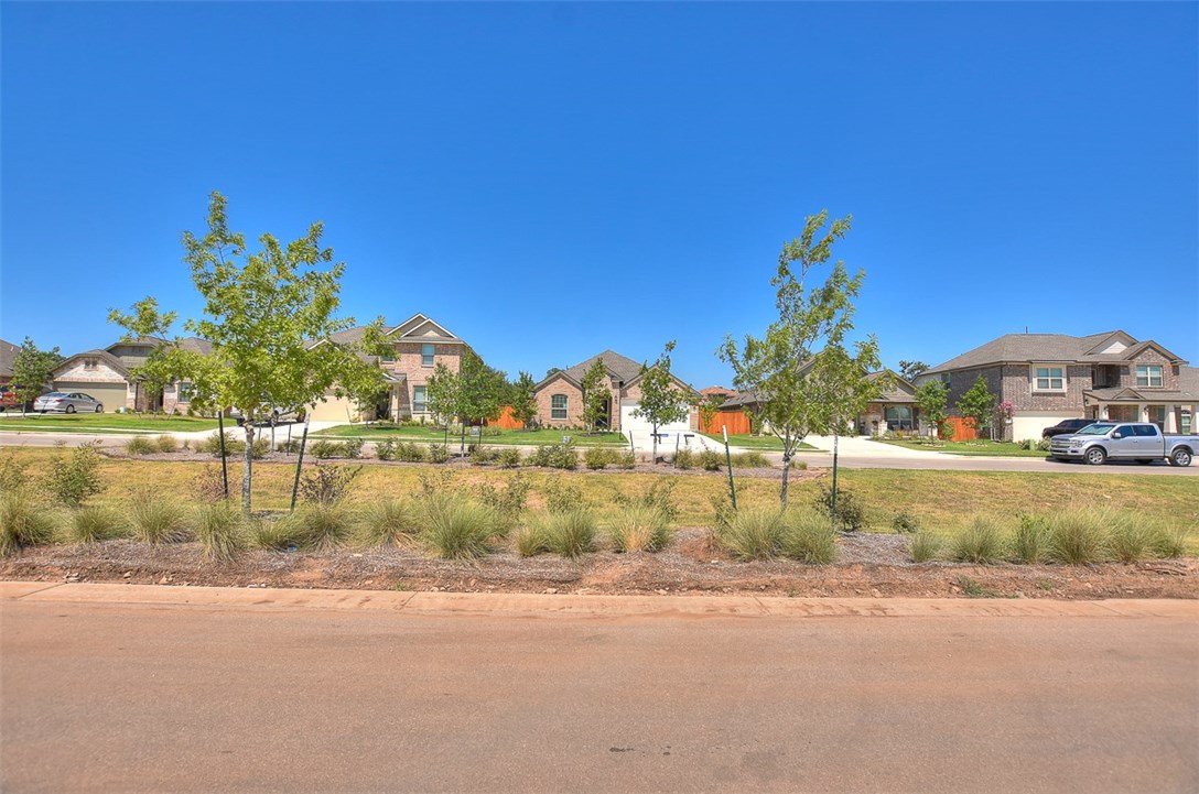 1449 Morning View Road Georgetown, TX 78628 - Photo 33 of 39 This is the street view from the front of the house. The neighbor's house is across the medium.