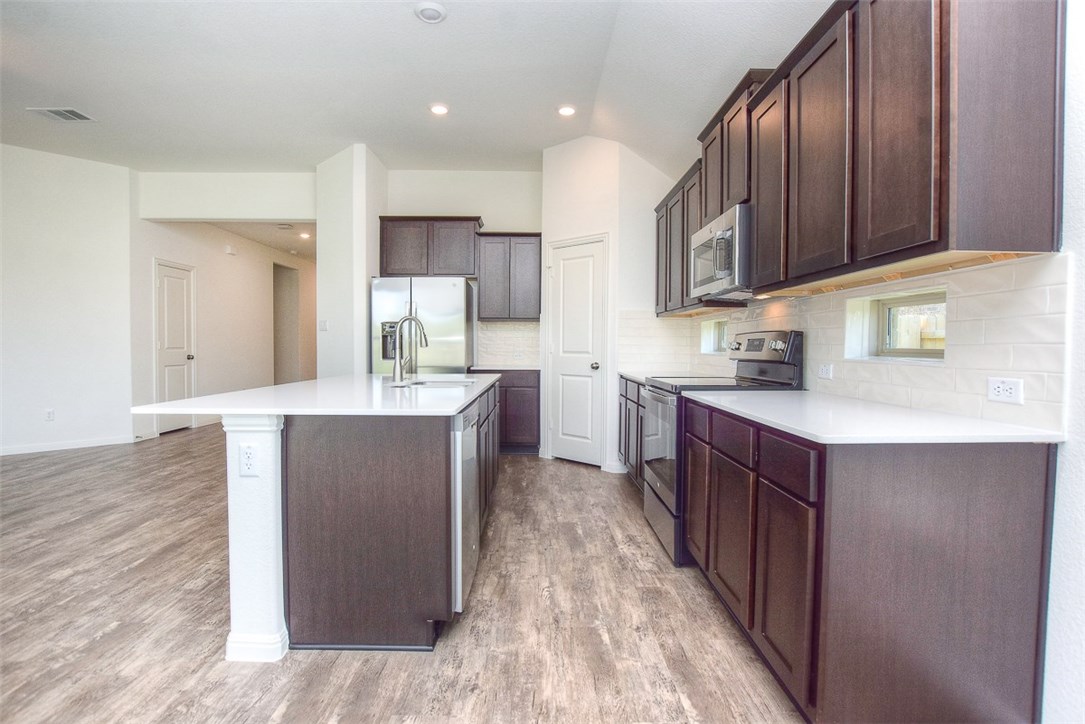 1449 Morning View Road Georgetown, TX 78628 - Photo 8 of 39 Center island can accommodate bar stools for extra seatings.