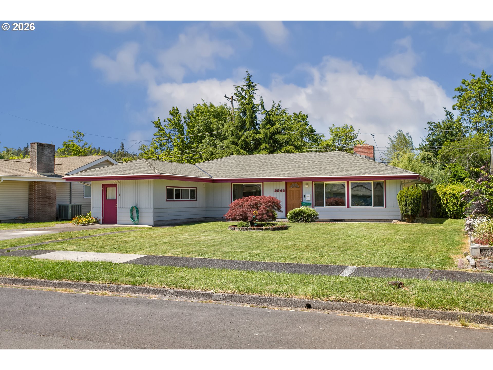 2840 Ferry Street Eugene, OR 97405 - Photo 3 of 35 a front view of a house with a yard and garage