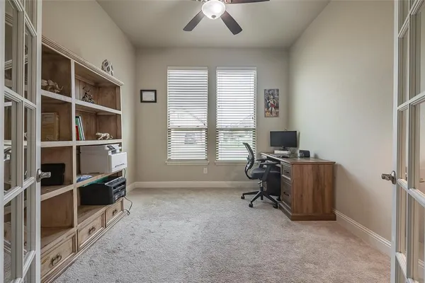a view of workspace with furniture and windows