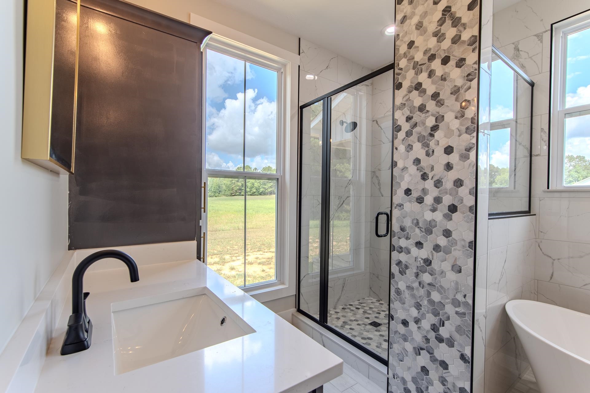 90 Columbus Lane Adamsville, TN 38310 - Photo 16 of 40 a bathroom with a shower and a sink