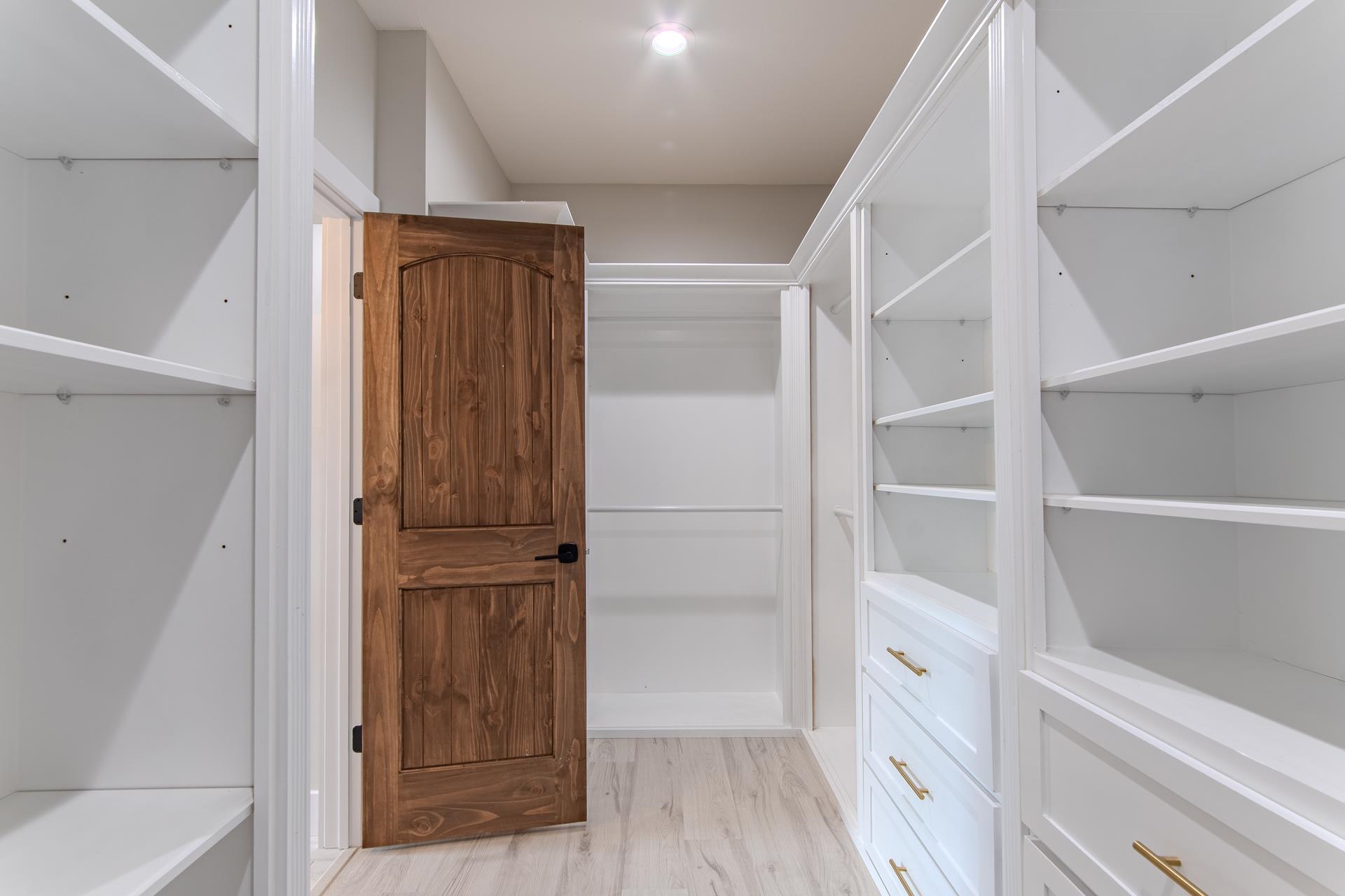 90 Columbus Lane Adamsville, TN 38310 - Photo 20 of 40 a view of walk in closet with empty racks
