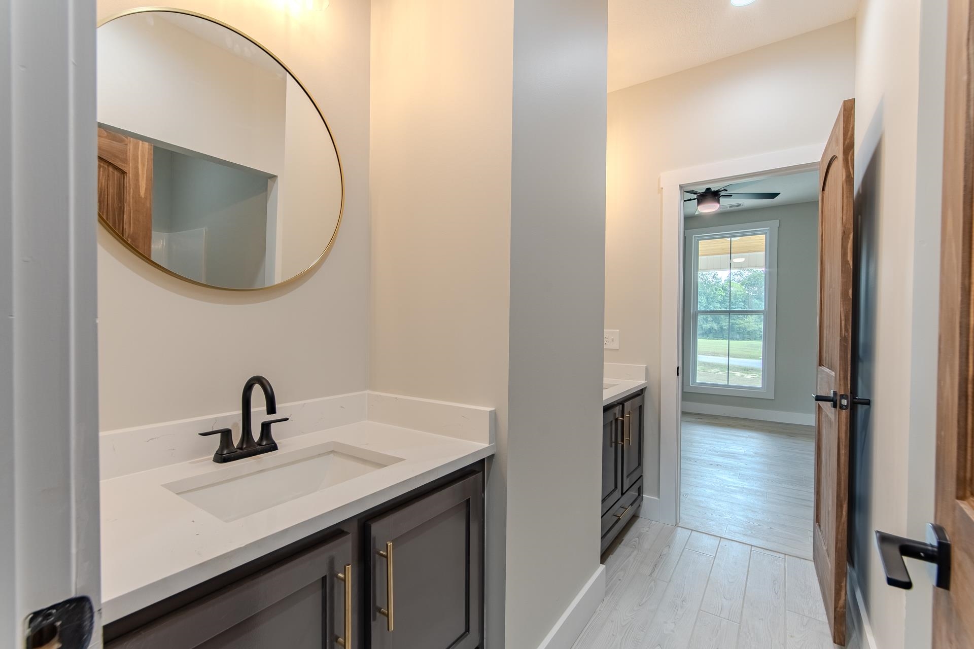 90 Columbus Lane Adamsville, TN 38310 - Photo 23 of 40 a bathroom with a sink and a mirror