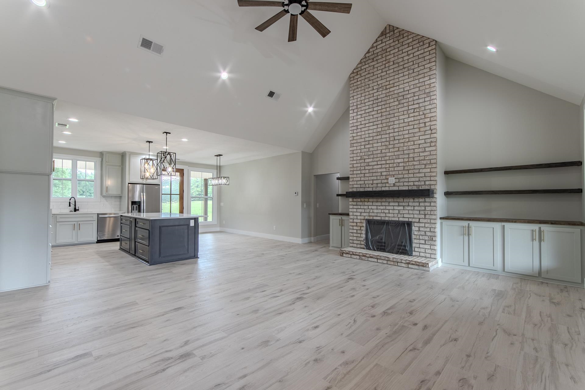90 Columbus Lane Adamsville, TN 38310 - Photo 9 of 40 an open kitchen with a table and kitchen view