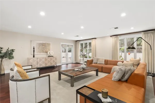 a living room with furniture and a table