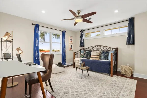 a living room with furniture and a window