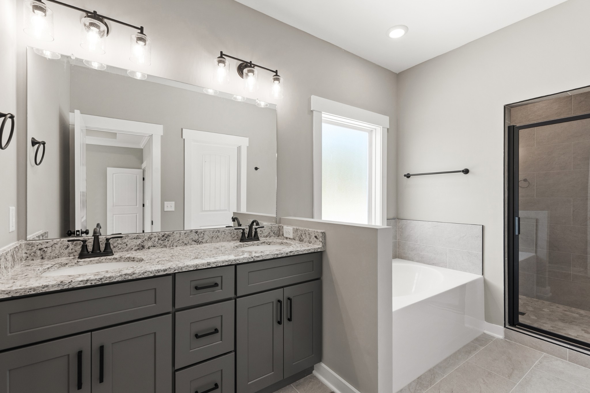 5638 Borthick Road Springfield, TN 37172 - Photo 22 of 43 a bathroom with a granite countertop sink mirror and bathtub