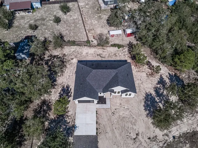 a view of a room with a furniture and window