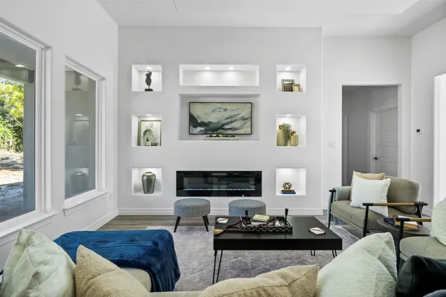 a living room with furniture and a large window