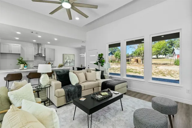 a living room with furniture a rug and a fireplace