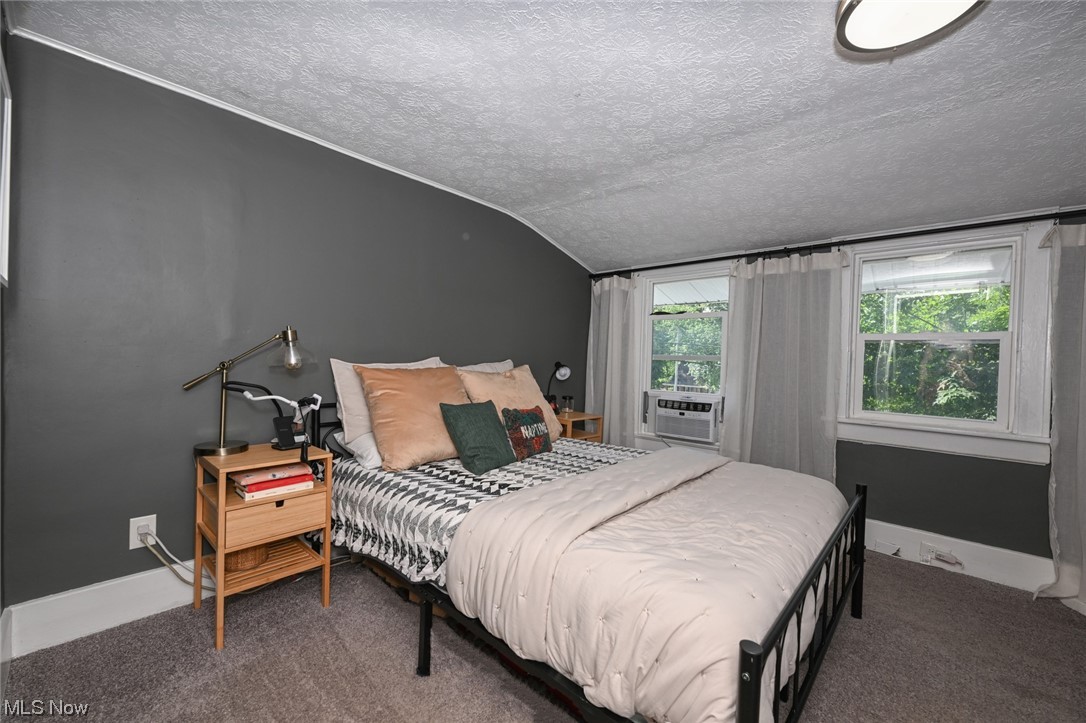181 Swartz Road Akron, OH 44319 - Photo 16 of 23 Heading upstairs, the largest of the rooms is being used as the master bedroom. The window air conditioners will convey with the property. Not seen is the huge double closet with organizing system.