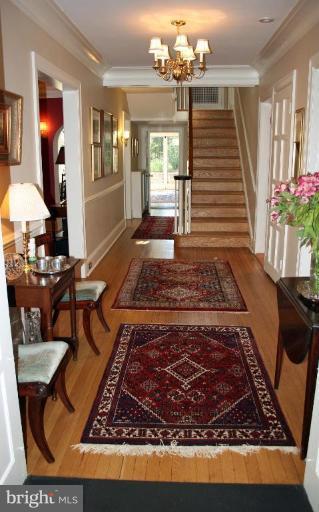 201 Goodale Road Baltimore, MD 21212 - Photo 12 of 30 a living room with furniture and a chandelier