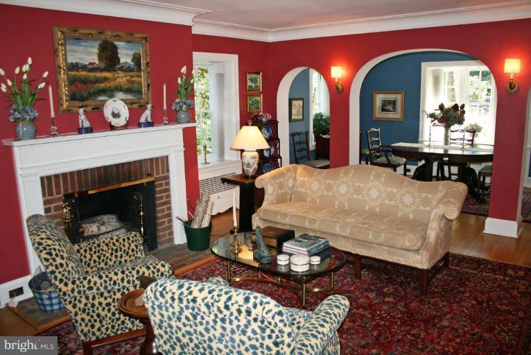201 Goodale Road Baltimore, MD 21212 - Photo 14 of 30 a living room with furniture a fireplace and a potted plant