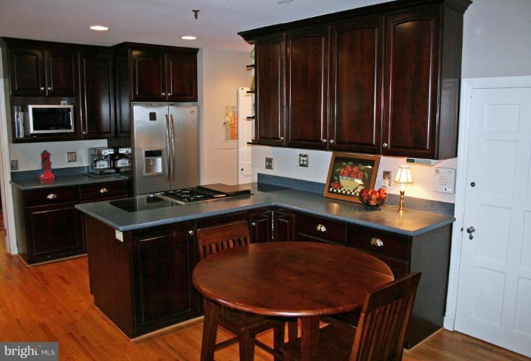 201 Goodale Road Baltimore, MD 21212 - Photo 24 of 30 a kitchen with stainless steel appliances granite countertop a stove refrigerator and a sink
