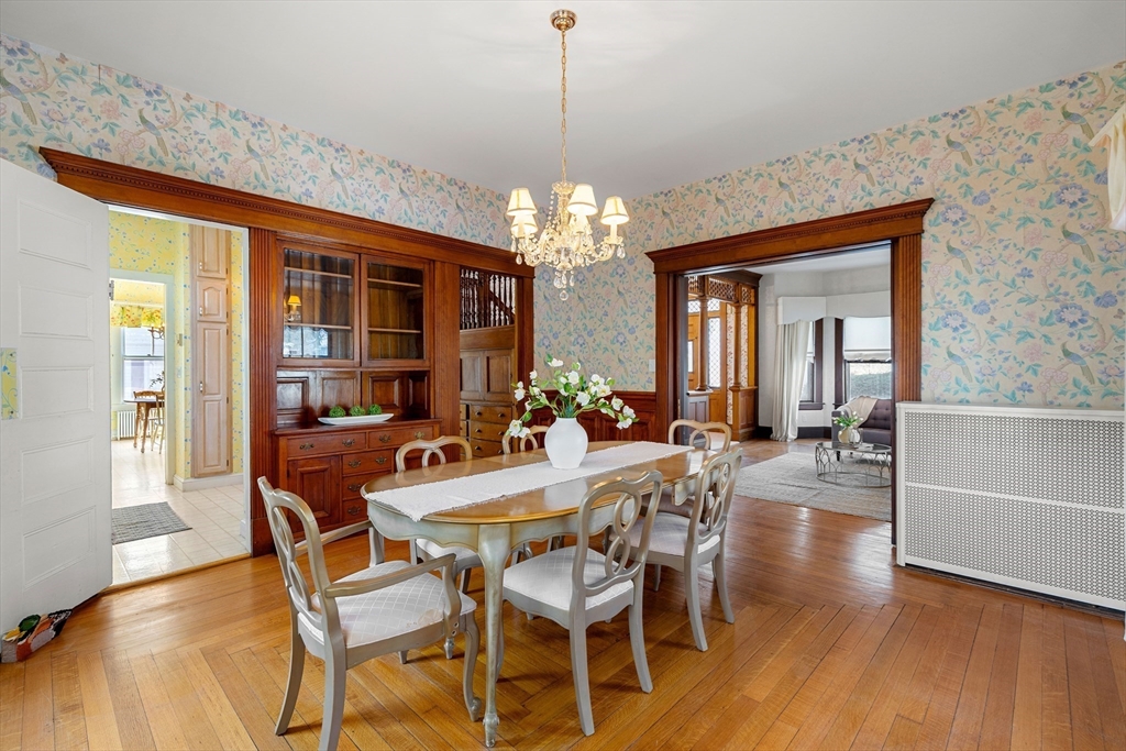 118 Sanders Avenue Lowell, MA 01851 - Photo 12 of 42 a view of a dining room with furniture wooden floor and chandelier
