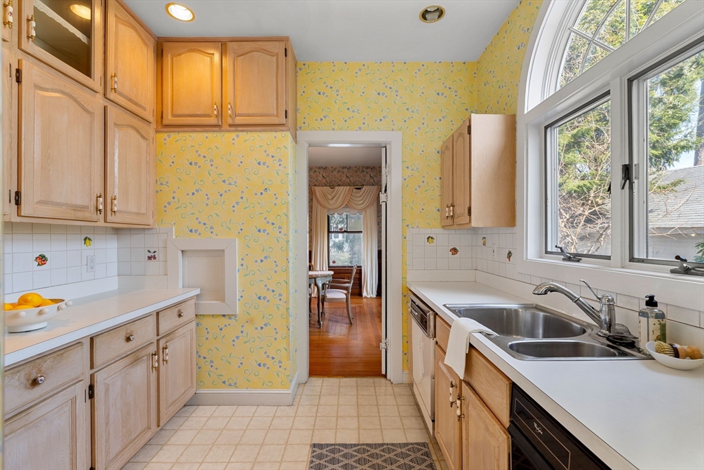 118 Sanders Avenue Lowell, MA 01851 - Photo 14 of 42 a kitchen with stainless steel appliances granite countertop a sink and cabinets