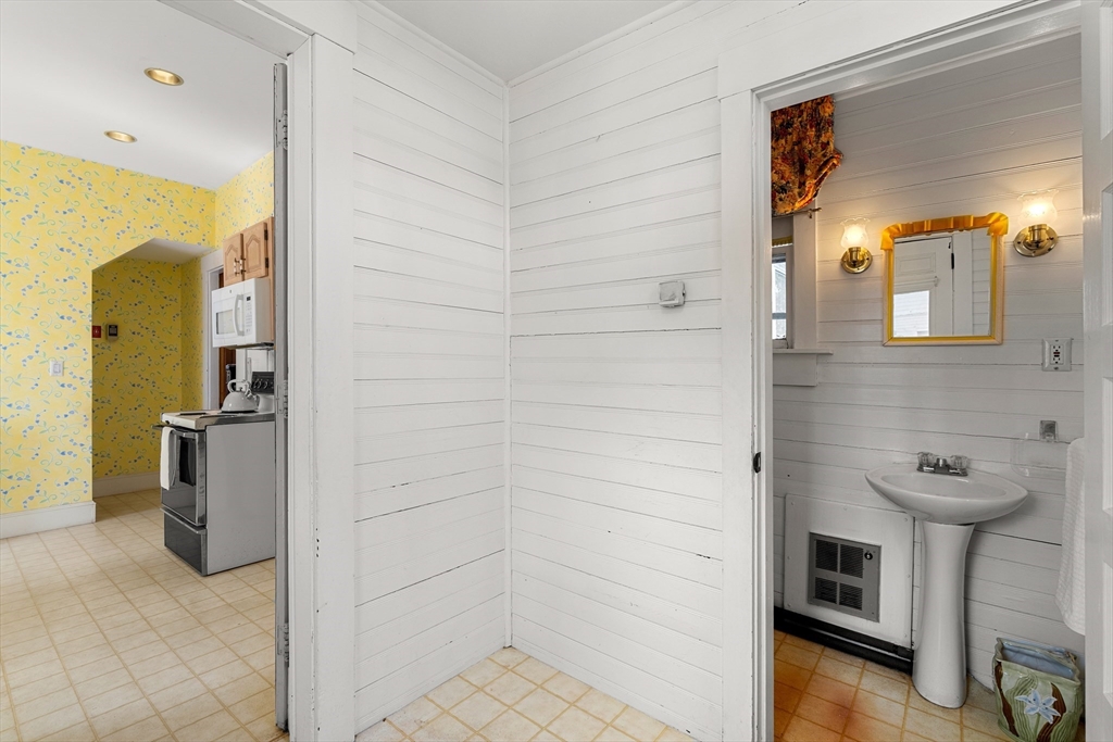 118 Sanders Avenue Lowell, MA 01851 - Photo 18 of 42 a bathroom with a shower