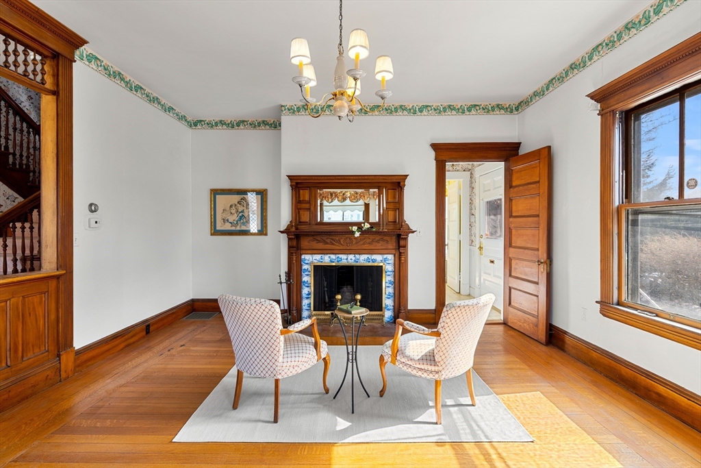 118 Sanders Avenue Lowell, MA 01851 - Photo 19 of 42 a view of a dining room with furniture a chandelier and wooden floor