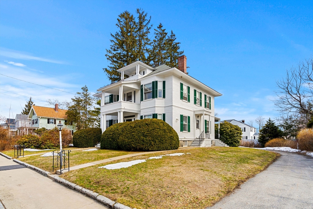 118 Sanders Avenue Lowell, MA 01851 - Photo 2 of 42 a front view of a house with a yard