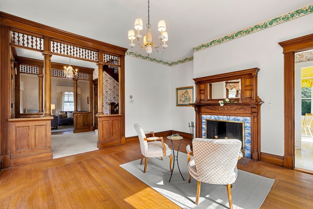 118 Sanders Avenue Lowell, MA 01851 - Photo 21 of 42 a living room with furniture and a fireplace with wooden floor