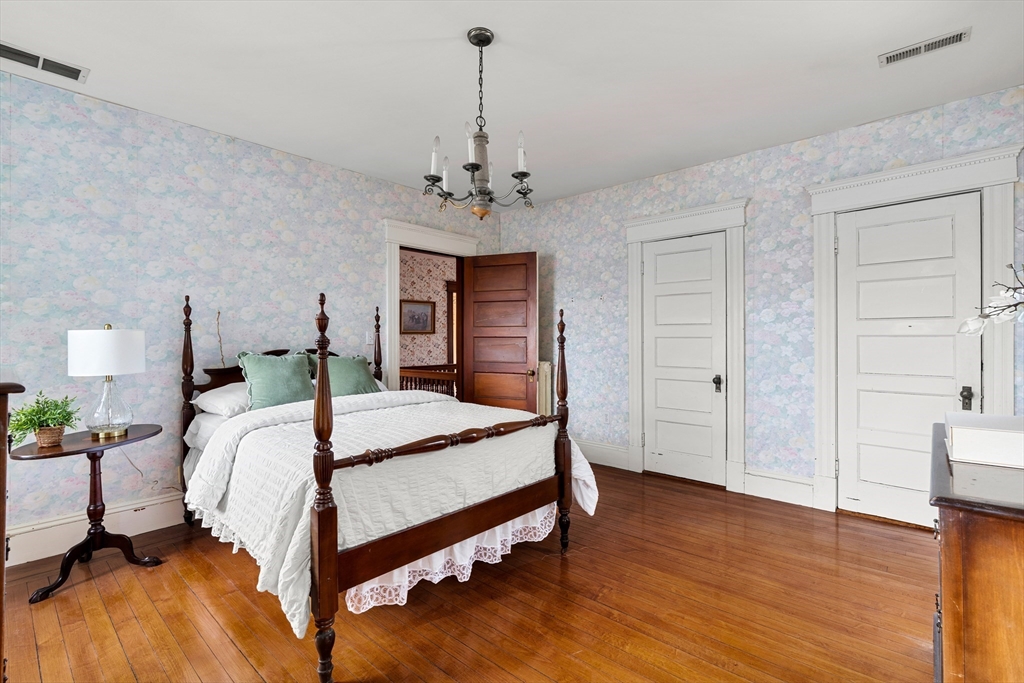 118 Sanders Avenue Lowell, MA 01851 - Photo 27 of 42 a bed room with a bed and a ceiling fan