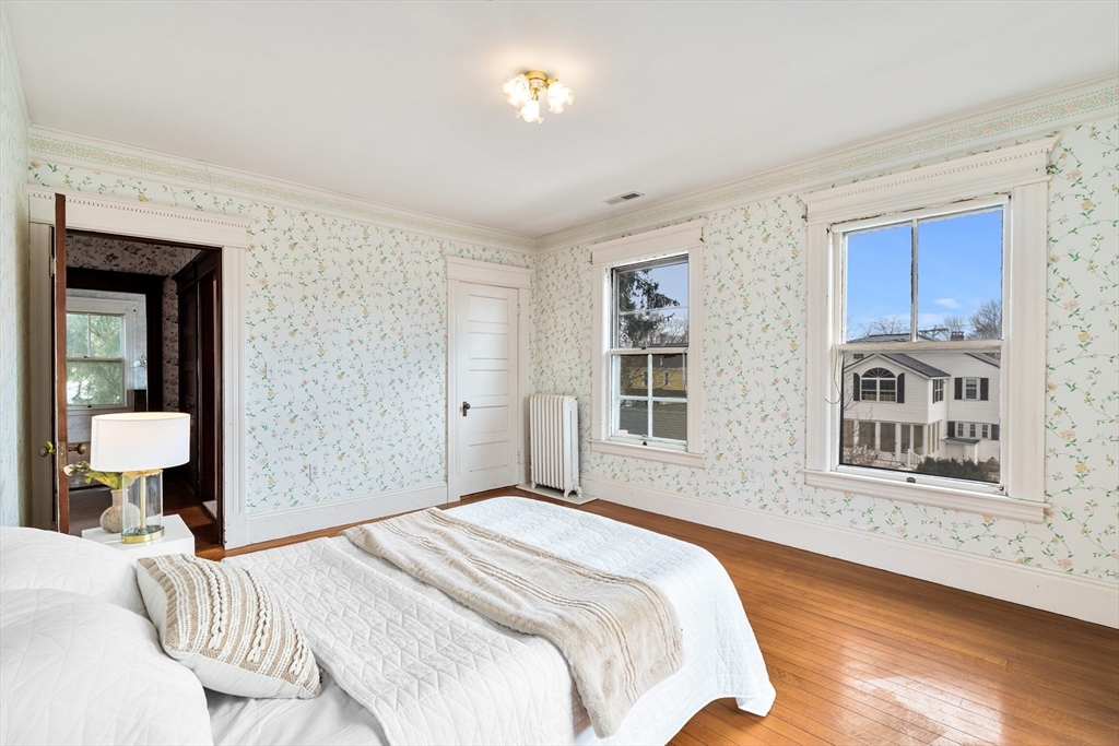 118 Sanders Avenue Lowell, MA 01851 - Photo 32 of 42 a bedroom with a bed and a window