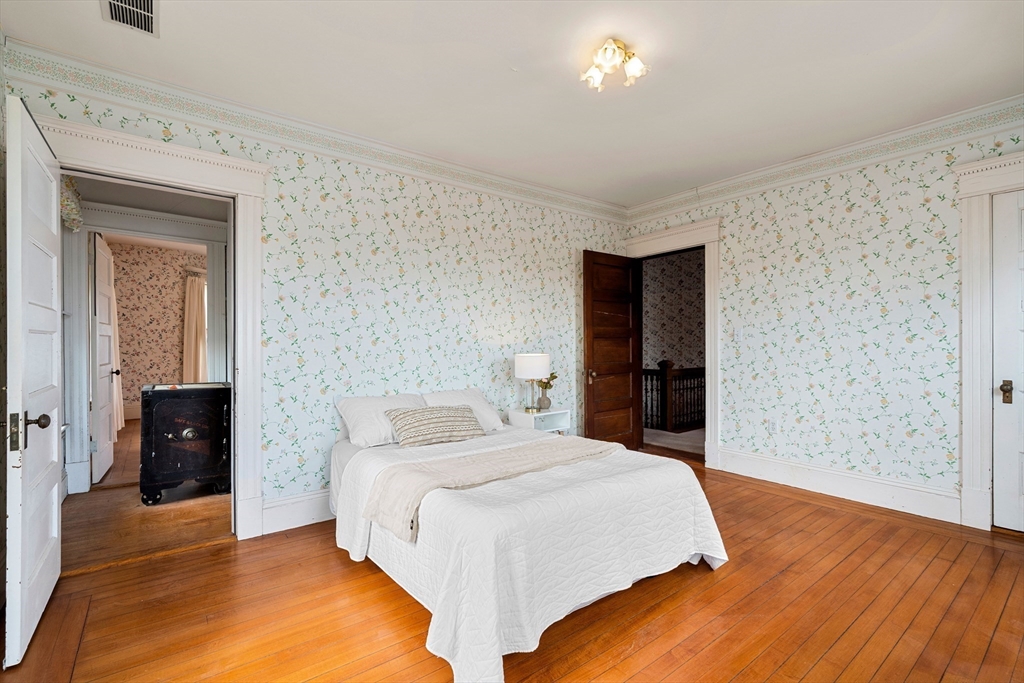 118 Sanders Avenue Lowell, MA 01851 - Photo 33 of 42 a bedroom with a bed and a dresser