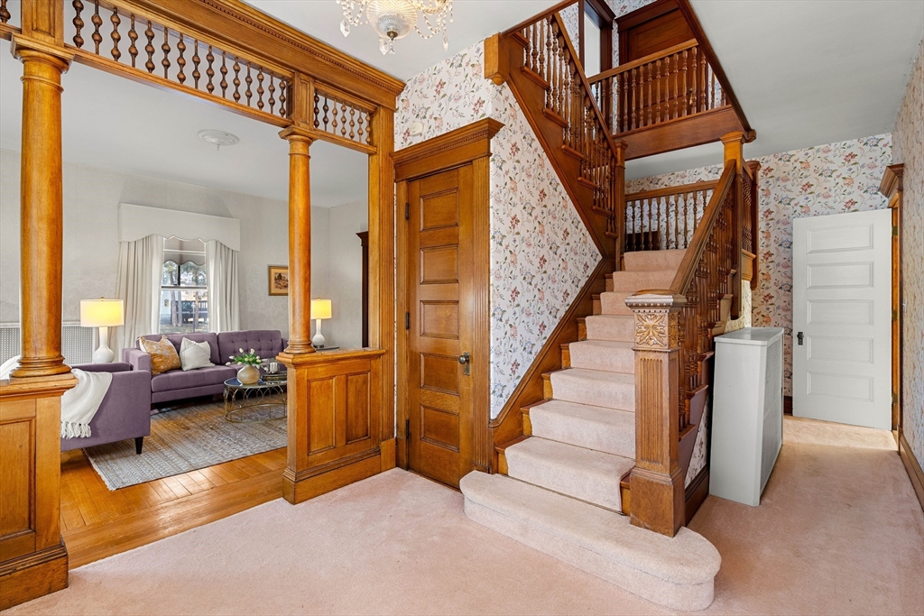 118 Sanders Avenue Lowell, MA 01851 - Photo 5 of 42 a view of a livingroom with furniture and stairs
