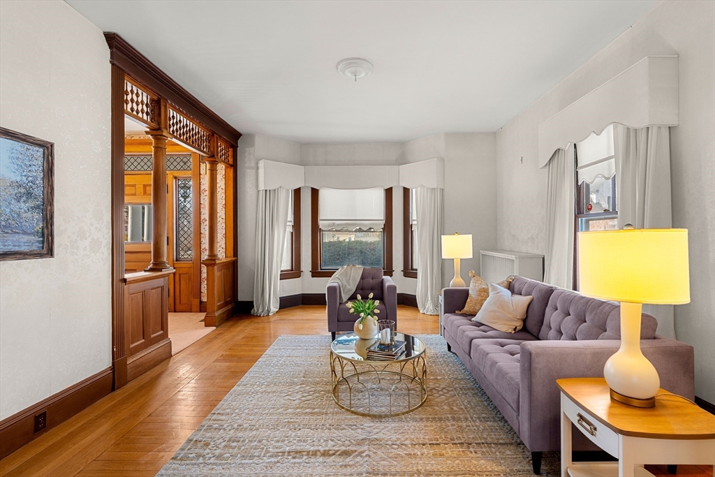 118 Sanders Avenue Lowell, MA 01851 - Photo 8 of 42 a living room with furniture and a large window