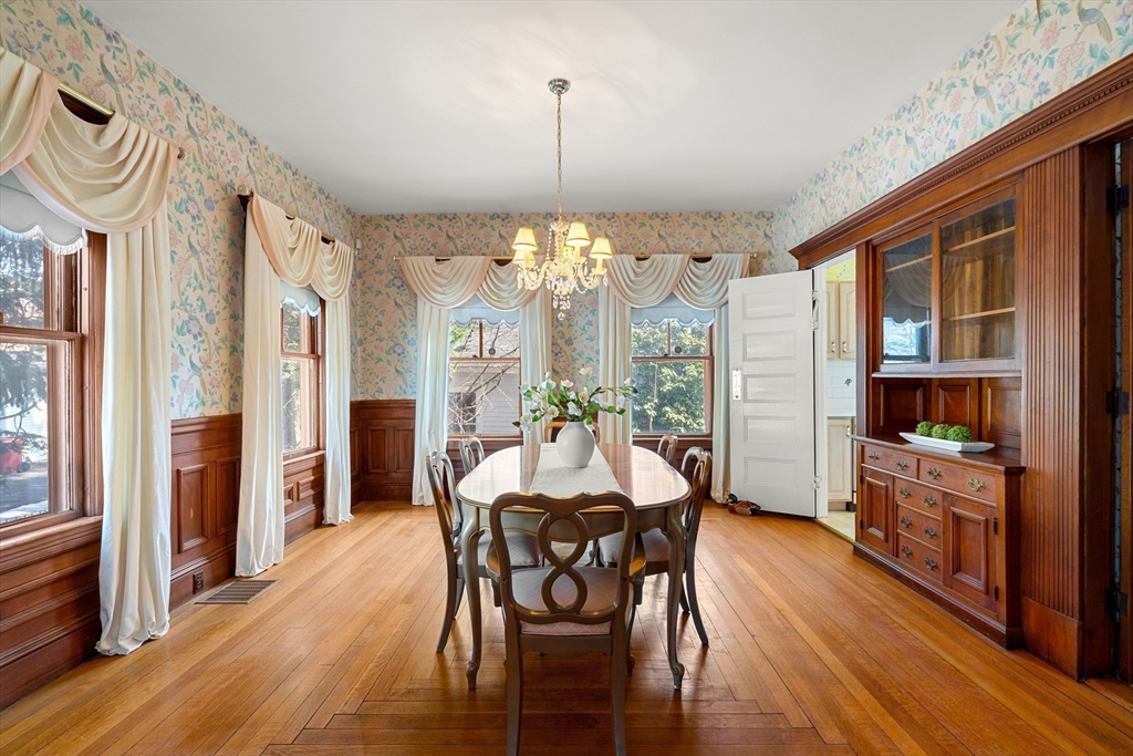 118 Sanders Avenue Lowell, MA 01851 - Photo 10 of 42 a view of a dining room with furniture window and wooden floor