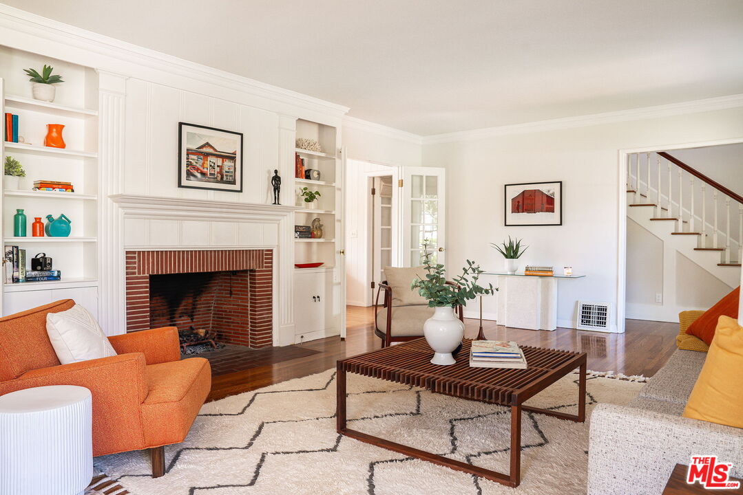 2166 Las Lunas Street Pasadena, CA 91107 - Photo 11 of 64 a living room with furniture and a fireplace