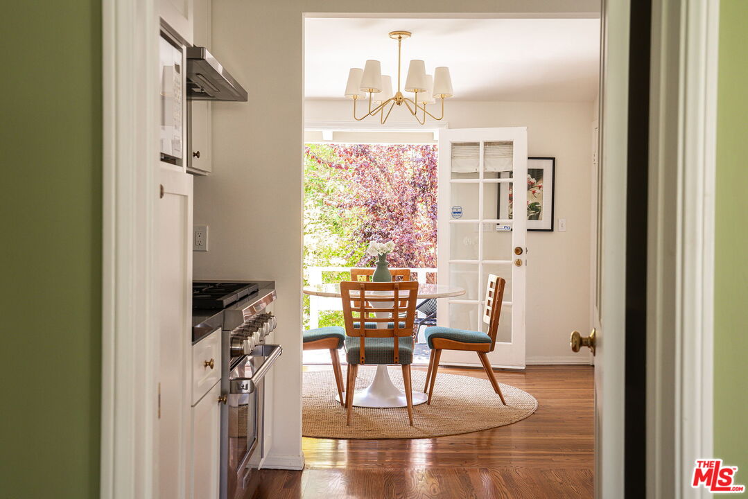 2166 Las Lunas Street Pasadena, CA 91107 - Photo 17 of 64 a view of a dining hall with a dining table and chairs