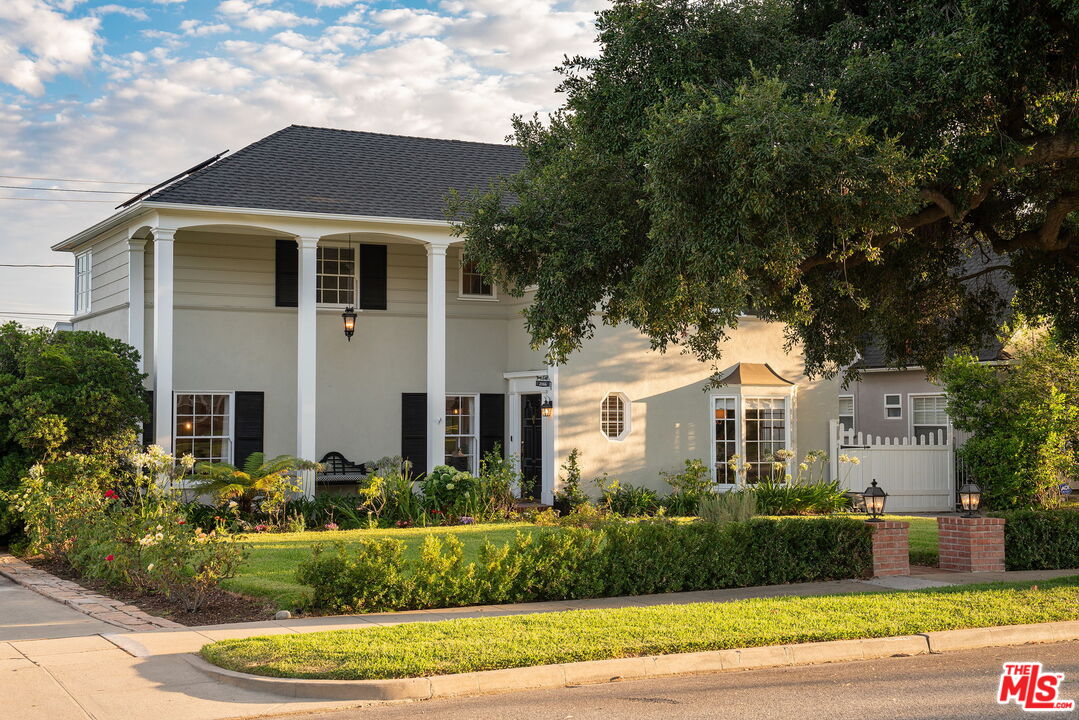 2166 Las Lunas Street Pasadena, CA 91107 - Photo 2 of 64 a front view of a house with a yard