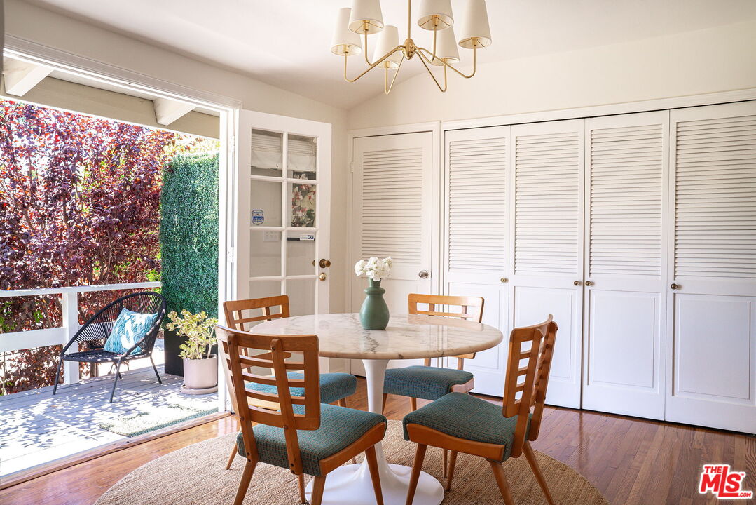 2166 Las Lunas Street Pasadena, CA 91107 - Photo 22 of 64 a view of a dining room with furniture window and wooden floor