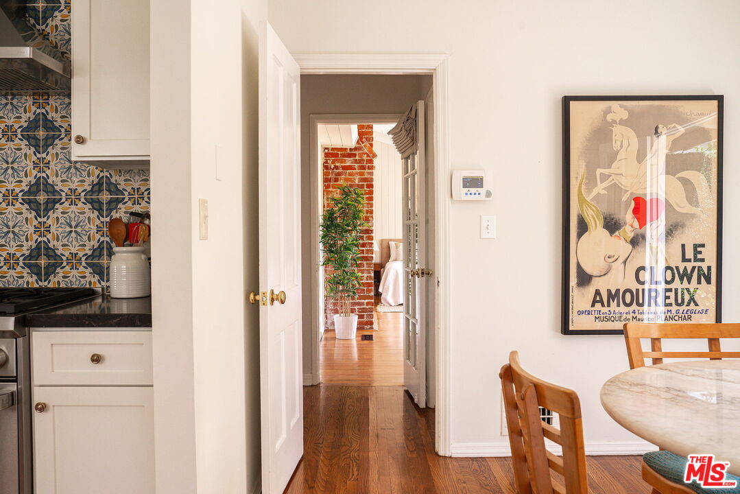 2166 Las Lunas Street Pasadena, CA 91107 - Photo 24 of 64 a view of a hallway with furniture and wooden floor