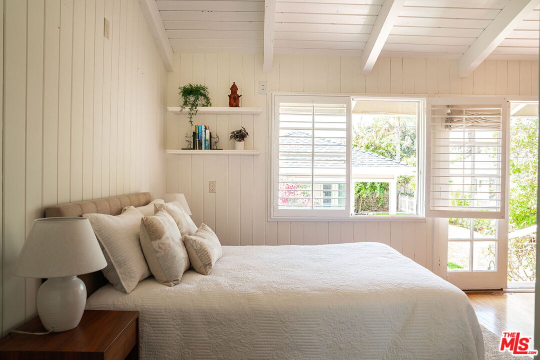 2166 Las Lunas Street Pasadena, CA 91107 - Photo 27 of 64 a bedroom with a bed and window