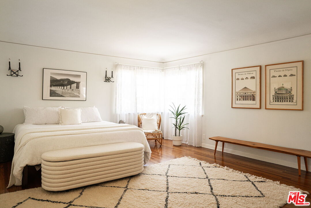 2166 Las Lunas Street Pasadena, CA 91107 - Photo 32 of 64 a bedroom with a bed and a painting on the wall