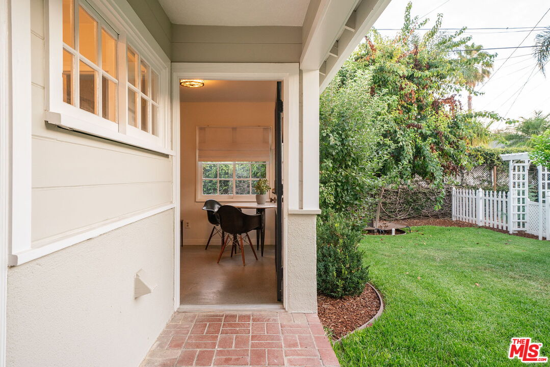 2166 Las Lunas Street Pasadena, CA 91107 - Photo 45 of 64 a view of a porch with chairs and backyard