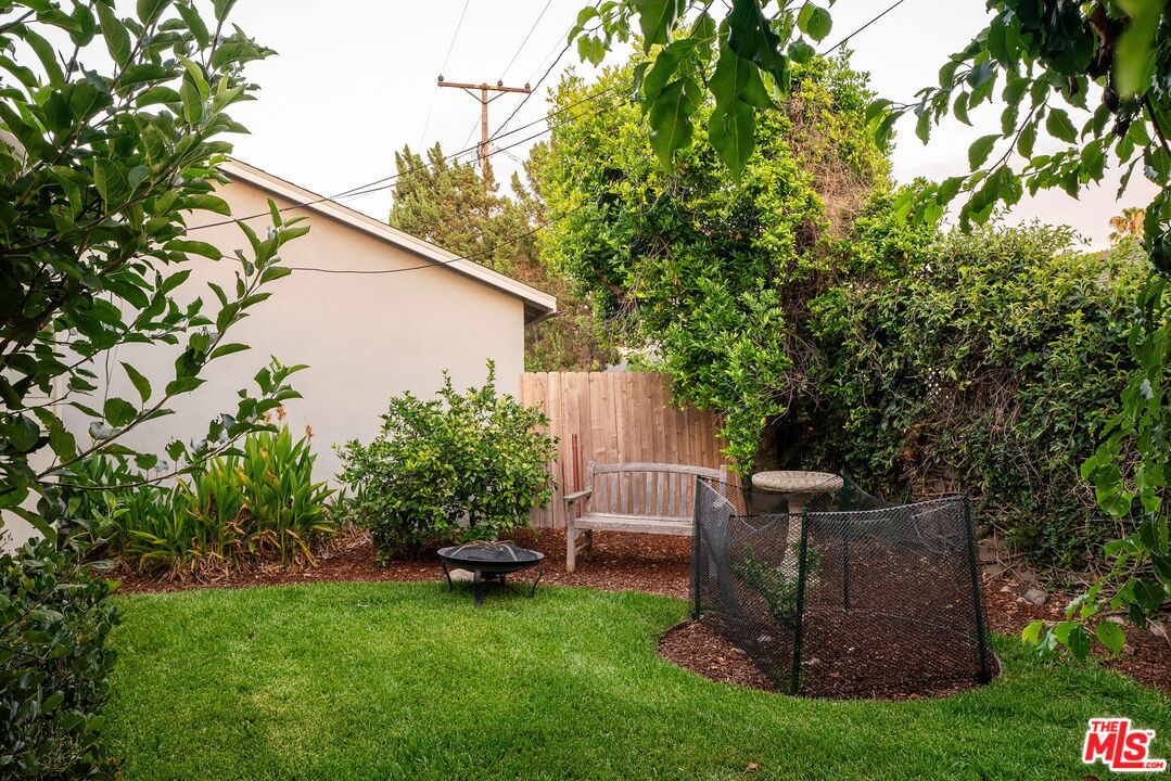 2166 Las Lunas Street Pasadena, CA 91107 - Photo 52 of 64 a backyard of a house with table and chairs