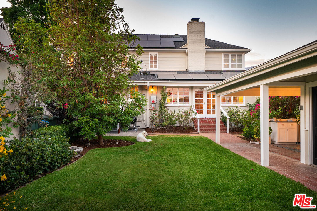 2166 Las Lunas Street Pasadena, CA 91107 - Photo 57 of 64 a front view of a house with a yard table and chairs