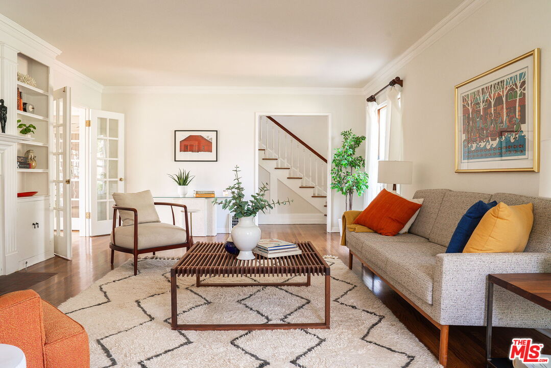 2166 Las Lunas Street Pasadena, CA 91107 - Photo 10 of 64 a living room with furniture and a painting on the wall