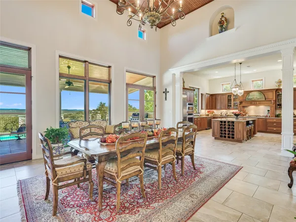 a outdoor dining area with furniture and outdoor view