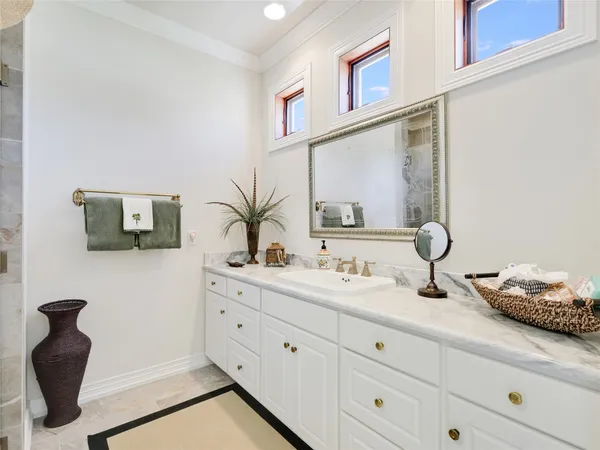 a bathroom with a double vanity sink and a mirror