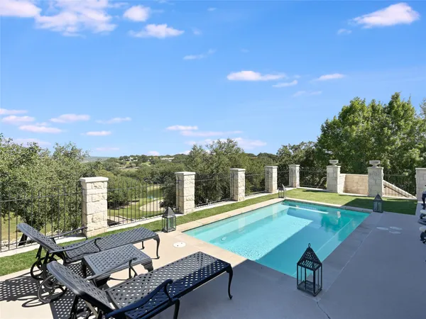 a view of a patio with swimming pool